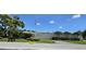 Magnolia Sun Center community building with landscaping and road at 5925 Terrace Park N Dr # 210, St Petersburg, FL 33709