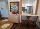 Cozy dining area open to the kitchen with modern decor and barstool seating at 5925 Terrace Park N Dr # 210, St Petersburg, FL 33709