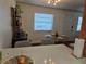 Dining space with modern lighting, a large window, and dark wood flooring throughout at 5925 Terrace Park N Dr # 210, St Petersburg, FL 33709