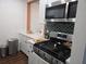 Well-equipped kitchen with stainless steel appliances and stylish countertops at 5925 Terrace Park N Dr # 210, St Petersburg, FL 33709