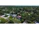 An aerial shot of a cozy single-Gathering home surrounded by trees and lush greenery at 5998 8Th S St, St Petersburg, FL 33705