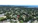 Aerial view of the property and neighborhood, highlighting nearby water and the surrounding tree coverage at 5998 8Th S St, St Petersburg, FL 33705