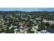 A high-angle shot captures the home's position within a tranquil and tree-filled residential area by the water at 5998 8Th S St, St Petersburg, FL 33705