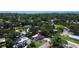Aerial view of a single-Gathering home nestled among trees and other homes in the suburban neighborhood at 5998 8Th S St, St Petersburg, FL 33705