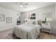 Well-lit bedroom features a ceiling fan, comfortable bed, and natural light from the large window at 5998 8Th S St, St Petersburg, FL 33705