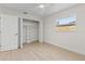 Bedroom featuring a large closet, window, and hardwood floors at 5998 8Th S St, St Petersburg, FL 33705