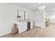 Bright room with a bar cabinet featuring white countertops and base, and modern decor at 5998 8Th S St, St Petersburg, FL 33705