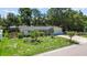 A neatly landscaped yard accents this charming single-Gathering home with a two-car garage at 5998 8Th S St, St Petersburg, FL 33705