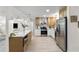 Spacious kitchen with stainless steel appliances, white countertops, and an island with seating at 5998 8Th S St, St Petersburg, FL 33705