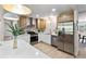 Modern kitchen with stainless steel appliances, white countertops, and ample cabinet space at 5998 8Th S St, St Petersburg, FL 33705