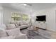 Inviting living room with lots of natural light, modern decor, and stylish seating at 5998 8Th S St, St Petersburg, FL 33705
