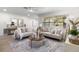 Bright and airy living room showcasing neutral decor, a large window, and stylish furnishings at 5998 8Th S St, St Petersburg, FL 33705