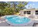 Beautiful backyard oasis with a sparkling pool and lush landscaping at 5998 8Th S St, St Petersburg, FL 33705