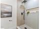 Modern shower with stylish tile work, matte black fixtures, and a convenient built-in shelf at 5998 8Th S St, St Petersburg, FL 33705