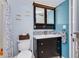 Bathroom showcases stylish vanity, modern faucet, mosaic backsplash and coordinated fixtures at 6932 Stones Throw N Cir # 7101, St Petersburg, FL 33710