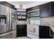 Updated kitchen features stainless steel refrigerator, granite counters and abundant cabinet space at 6932 Stones Throw N Cir # 7101, St Petersburg, FL 33710
