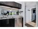 Well-appointed kitchen with stainless steel dishwasher, granite countertops, and an open design to the living area at 6932 Stones Throw N Cir # 7101, St Petersburg, FL 33710