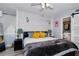 Bright main bedroom boasts accent wall, stylish lighting and ensuite bathroom with barn door access at 6932 Stones Throw N Cir # 7101, St Petersburg, FL 33710