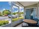 Screened patio is ideal for relaxation while overlooking a parking lot and tropical landscaping at 6932 Stones Throw N Cir # 7101, St Petersburg, FL 33710