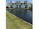 Well-maintained condo complex featuring a relaxing community pond with fountain at 6932 Stones Throw N Cir # 7101, St Petersburg, FL 33710
