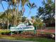 Inviting condominium complex sign surrounded by lush landscaping, offering a glimpse of the charming community at 6932 Stones Throw N Cir # 7101, St Petersburg, FL 33710
