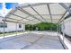 Spacious carport attached to a house, offering ample covered parking at 8001 N Highland Ave, Tampa, FL 33604