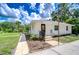 Charming single-story home with landscaped front yard and a neatly manicured lawn at 8001 N Highland Ave, Tampa, FL 33604