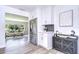Bright kitchen with new appliances and flooring, open to the living area with lots of natural light at 8001 N Highland Ave, Tampa, FL 33604