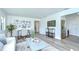 Cozy living room featuring hardwood floors, stylish decor, and plenty of natural light at 8001 N Highland Ave, Tampa, FL 33604