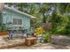 This backyard features a patio with a blue picnic table and lush garden at 8014 27Th N Ave, St Petersburg, FL 33710