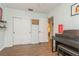 Spacious room with hardwood floors, a closet, and an upright piano at 8014 27Th N Ave, St Petersburg, FL 33710