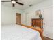 Cozy bedroom featuring a ceiling fan, a closet, and light green walls at 8014 27Th N Ave, St Petersburg, FL 33710