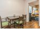 Cozy dining area with hardwood floors and a wooden table with four chairs at 8014 27Th N Ave, St Petersburg, FL 33710