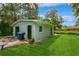 Exterior of detached garage with green lawn at 8014 27Th N Ave, St Petersburg, FL 33710