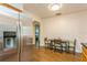 Galley style kitchen featuring stainless steel refrigerator and hardwood flooring at 8014 27Th N Ave, St Petersburg, FL 33710