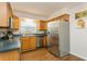 Modern kitchen featuring stainless steel appliances and wooden cabinets at 8014 27Th N Ave, St Petersburg, FL 33710