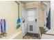 Mud room featuring a convenient washer and dryer, utility sink, bench and storage at 8014 27Th N Ave, St Petersburg, FL 33710