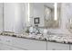 Bathroom vanity with granite counters, modern fixtures, and bright lighting at 8105 N Grady Ave, Tampa, FL 33614
