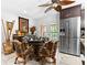 Charming dining area with unique ceiling fan, modern appliances, and patio access at 8105 N Grady Ave, Tampa, FL 33614