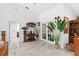 Bright and airy foyer with marble flooring, plants, and decorative accents at 8105 N Grady Ave, Tampa, FL 33614