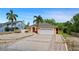Charming single-story home featuring a spacious driveway and a well-manicured lawn at 8105 N Grady Ave, Tampa, FL 33614