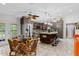 Spacious kitchen with an island, tile floors, stainless steel appliances, and plenty of seating at 8105 N Grady Ave, Tampa, FL 33614