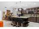 Kitchen with granite countertops, central island, stainless steel refrigerator and modern lighting at 8105 N Grady Ave, Tampa, FL 33614