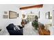 Bright living room with hardwood floors, neutral walls, and multiple seating arrangements at 8105 N Grady Ave, Tampa, FL 33614