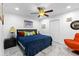 Bright main bedroom with ceiling fan, bedside table, and comfortable furnishings at 8105 N Grady Ave, Tampa, FL 33614
