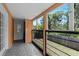Bright and airy sun room with large windows that offer scenic views of the outdoors at 8105 N Grady Ave, Tampa, FL 33614
