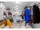 Spacious walk-in closet with clothing, shelving, and storage items at 8105 N Grady Ave, Tampa, FL 33614