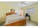 Bright bedroom featuring a light wood bed frame and a window letting in natural light at 917 Pineview Ave, Clearwater, FL 33756