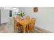 Dining room featuring hardwood floors, neutral walls, and wooden table with 4 chairs at 917 Pineview Ave, Clearwater, FL 33756
