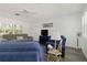 Bright living room with hardwood floors, neutral walls, ceiling fan and comfortable seating at 917 Pineview Ave, Clearwater, FL 33756